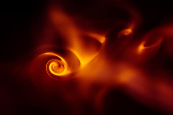 spiral or swirl of orange energy with black background